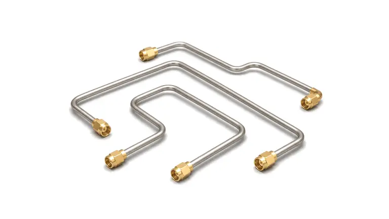 Semi-rigid RF cable formed for compact microwave module routing